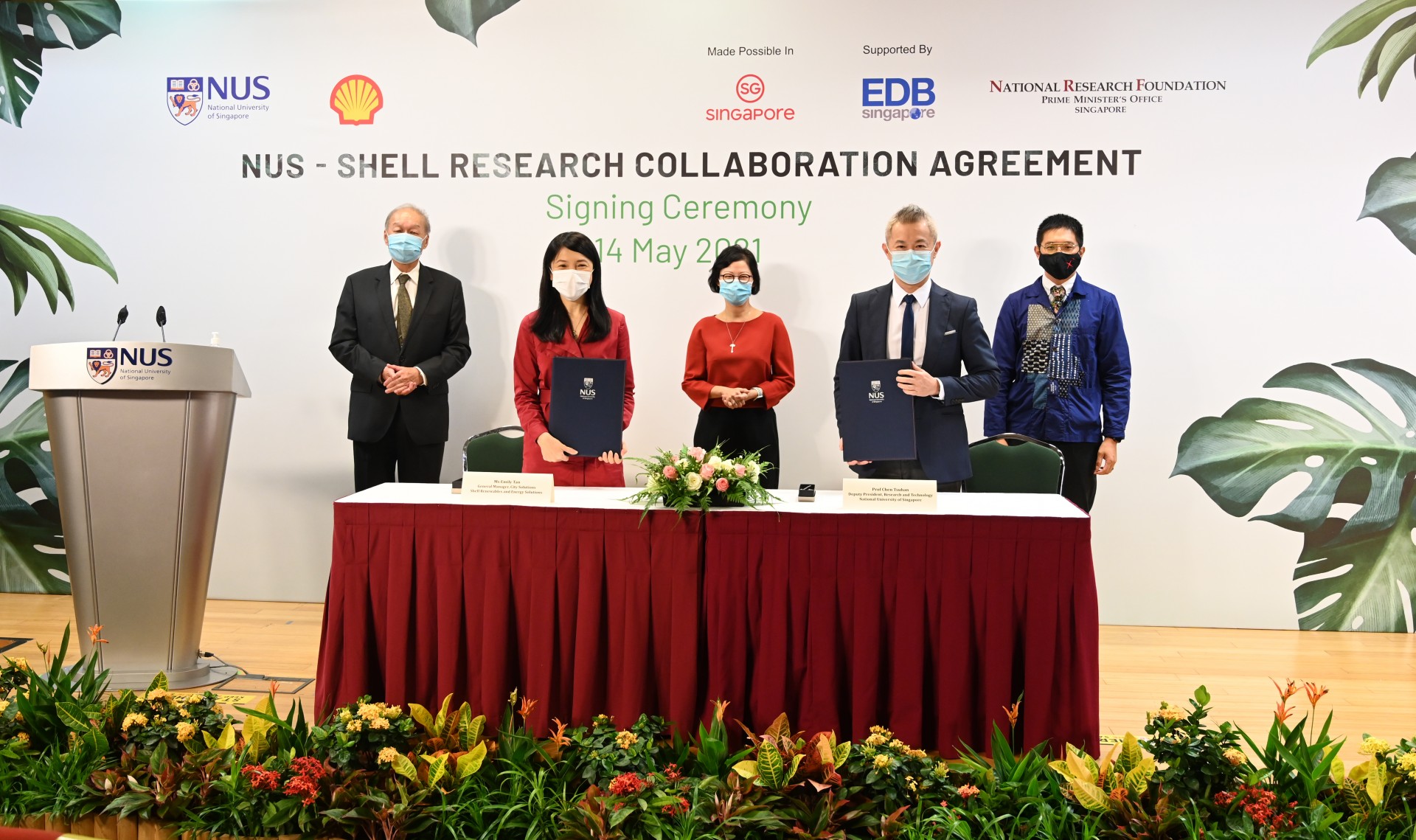 The research agreement was inked by (front row, from left) Ms Emily Tan, General Manager, City Solutions, Shell Renewables and Energy Solutions, and Professor Chen Tsuhan, NUS Deputy President (Research and Technology). The signing was witnessed by (back row, from left) Professor Low Teck Seng, Chief Executive Officer, National Research Foundation Singapore, Ms Aw Kah Peng, Chairman, Shell Companies in Singapore, and Mr Chng Kai Fong, Managing Director, Singapore Economic Development Board.