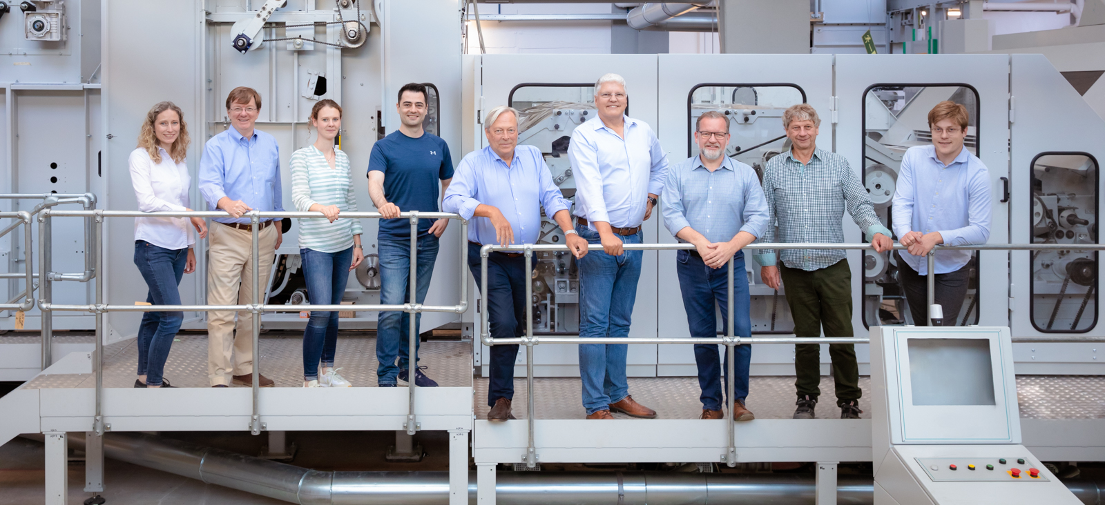 Members of the BFT/FVT-team in front of the new installed  textile processing facility