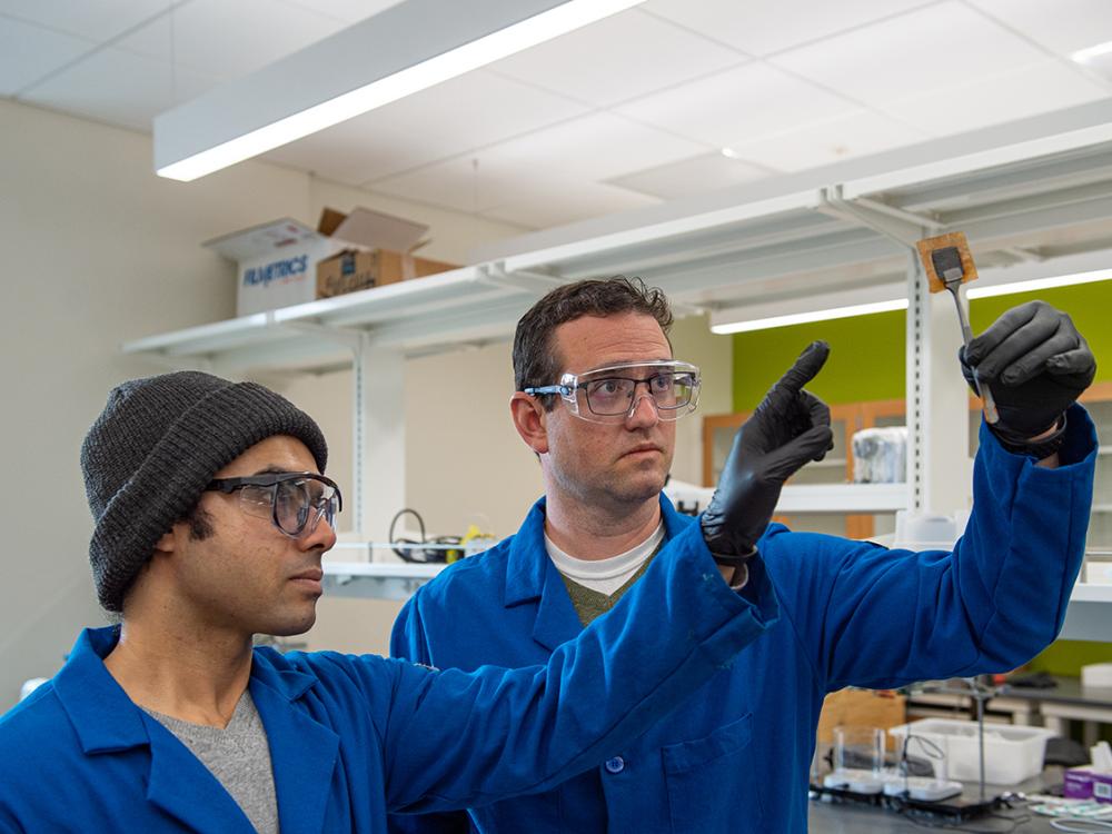 Chris Arges (right), Penn State associate professor of chemical engineering, proposes using high-temperature proton-selective polymer electrolyte membranes, or PEMs, to separate hydrogen from other gases in an ACS Energy Letters paper. Co-author Deepra Bhattacharya, Penn State doctoral student in chemical engineering, is seen at left.