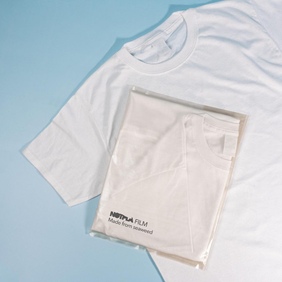 Notpla Film, a flexible film made from seaweed, is used here as a polybag for a T-shirt. 