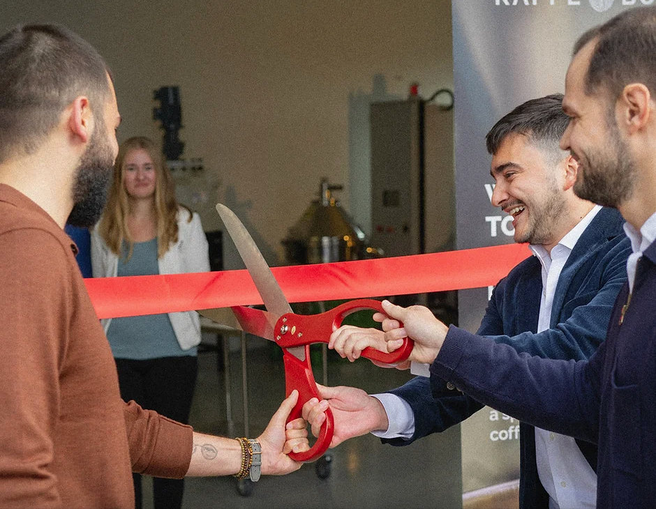 The three founders of Kaffe Bueno cut the ribbon and with it open the world's first coffee biorefinery.