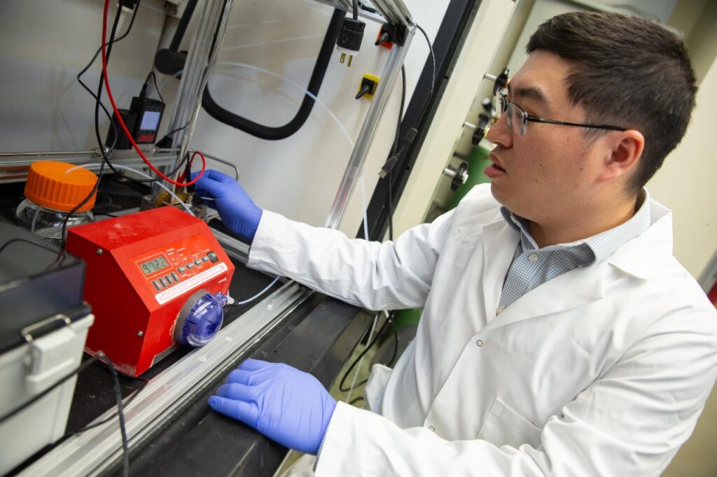 In his chemical engineering lab, Associate Professor Jingjie Wu experiments with new ways to convert carbon dioxide into useful industrial products. 