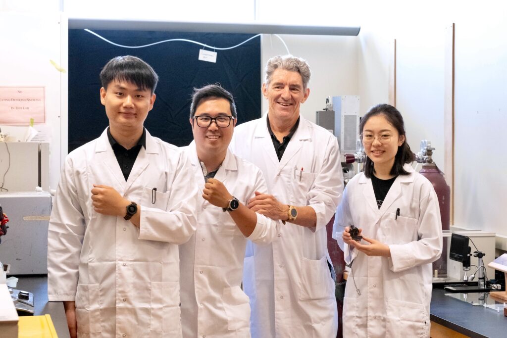 UBC forestry researchers have created a new super-black material that absorbs almost all light. From left, Dengcheng Feng, Kenny Cheng, Dr. Philip Evans and Sara Xu.