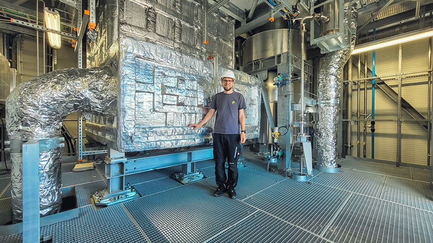 Lukas Geissbühler, Head Thermal Systems at Synhelion, with DAWN's thermal energy storage.