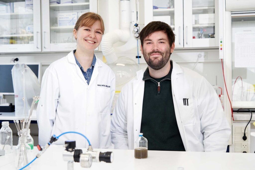  "In a net-zero future, we need to use technology that recycles the CO2 we capture instead of continuing to extract more from the ground," says Amalie Kirstine Hessellund Nielsen, a PhD student at the Department of Biological and Chemical Engineering (left). Right is Postdoc Mads Ujarak Sieborg. 