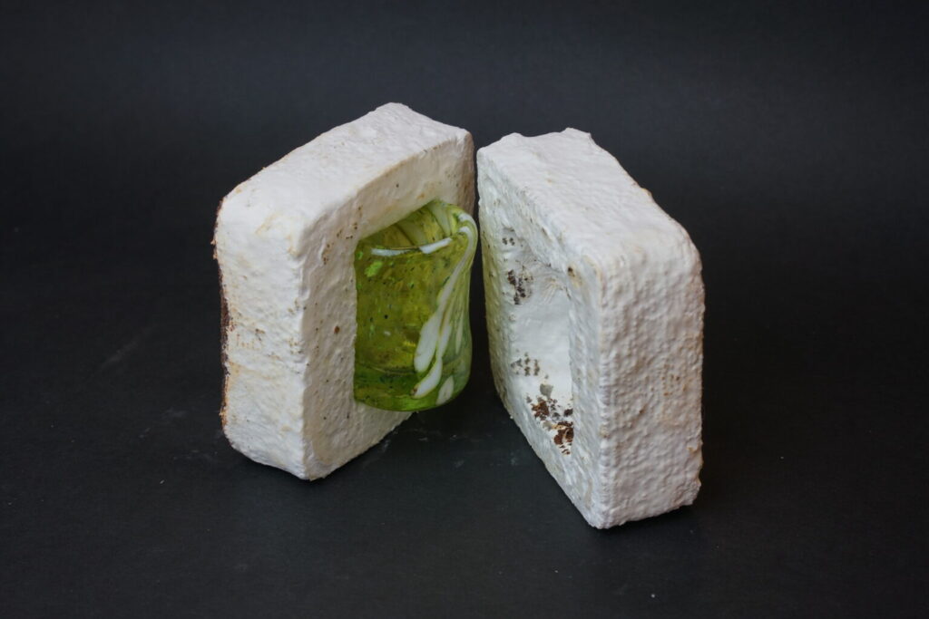 The packing material around this small glass was 3D printed from used coffee grounds. A white mycelium (sort of a root system for mushrooms) grows on the outside, which turns the grounds into a compostable alternative to Styrofoam.