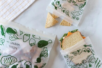 Lunchskins ziptop compostable food storage bags filled with various foods, showing writable surfaces and versatile food storage use.