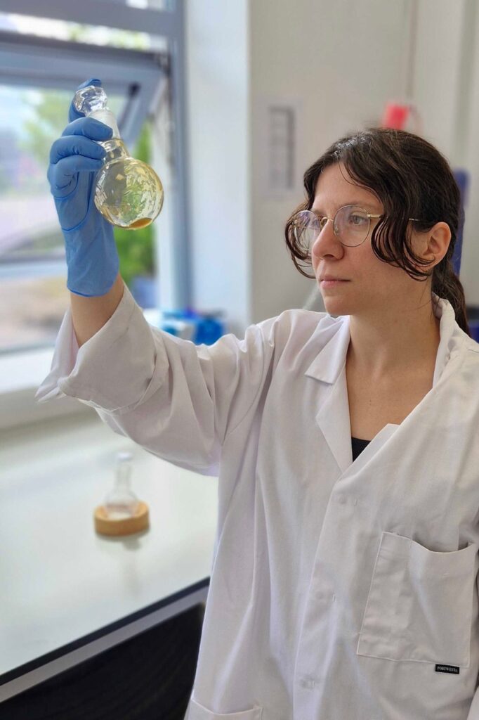 Devulcanised rubber in a round-bottomed flask in Addible lab. 