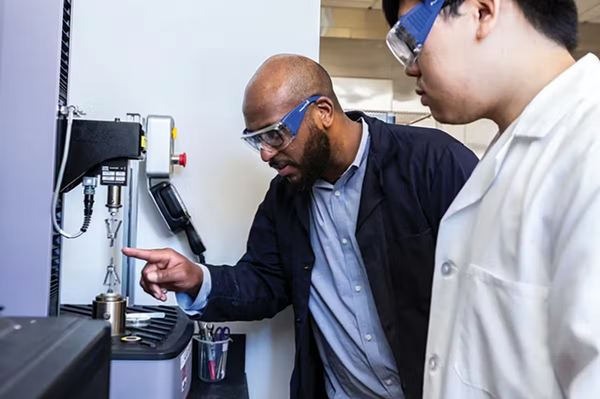 (From left) Marcus Foston, professor of energy, environmental & chemical engineering, with Zhenqin “Jerry” Wang, in Foston's Bioproducts Engineering Lab. 