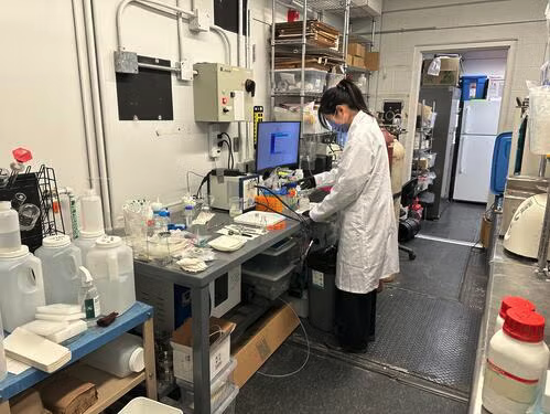 Waterloo PhD student Wei Wei, who led the research, works in the lab on plastic upcycling.