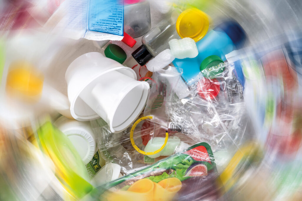 Circular economy means decoupling growth from resource consumption. The image represents the variety of plastic waste generated by an average household. The aim is to establish a new understanding of plastic waste as a resource and to view research into recycling options as an opportunity. BASF contributes to closing and expanding the loops by developing and implementing circular solutions for various materials, further optimizing our operations, and offering resource-efficient products and services that support our customers' circular goals.
