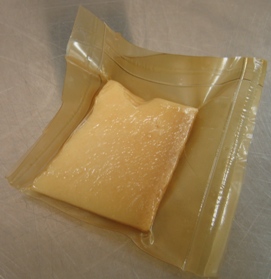 Biodegradable container for cheese