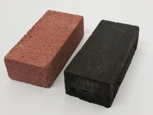 An ordinary construction brick, left, and an experimental brick made of a protein/lunar regolith mixture. | Photo by Mia Allende